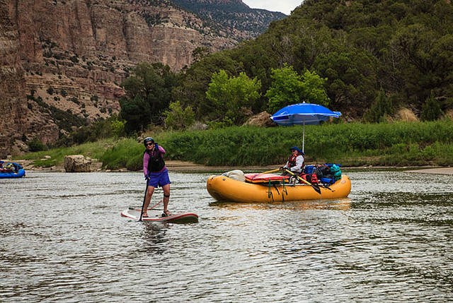 Rachel on SUP, Larry rowing print